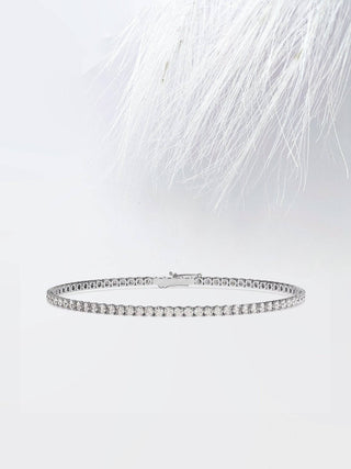 Pulsera de tenis con diamantes de moissanita de talla redonda en oro blanco de 14 quilates