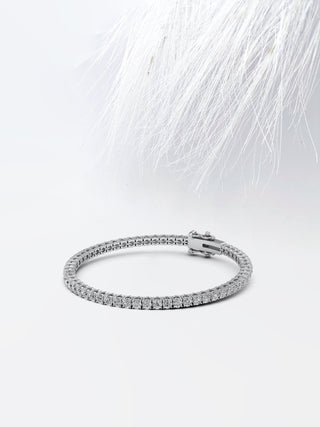 Pulsera de tenis con diamantes y moissanita redonda en oro blanco