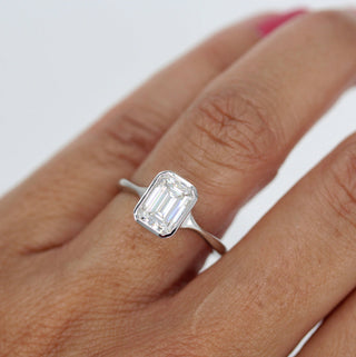 1.7ct Bezel Set Emerald Cut Moissanite Diamond Solitaire Engagement Ring In 14K White Gold