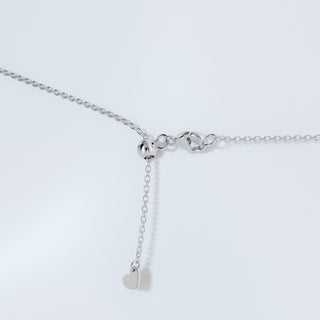 Collier solitaire avec lunette en diamant et moissanite ronde de 0,50 ct