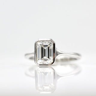 1.7ct Bezel Set Emerald Cut Moissanite Diamond Solitaire Engagement Ring In 14K White Gold