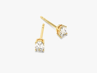 Boucles d'oreilles à tige en or jaune avec diamants et moissanite à taille ovale