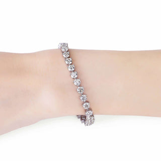 Pulsera de tenis con diamantes y moissanita redonda para mujer en oro blanco